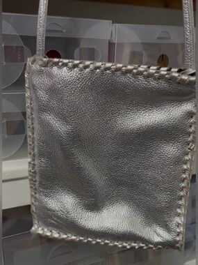 Kurtmen Metallic Silver Women’s Crossbody Bag with Whipstitch Trim